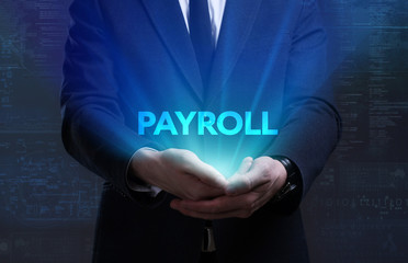 Business, Technology, Internet and network concept. Young businessman working on a virtual screen of the future and sees the inscription: Payroll