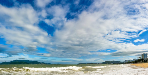 blue sky over wide sandy tropical beach