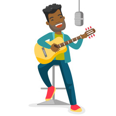 Young african-american male singer playing guitar