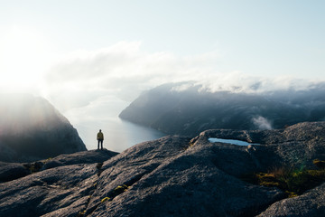 Misty morning on Preikestolen (pulpit-rock) - famous tourist attraction in the municipality of...