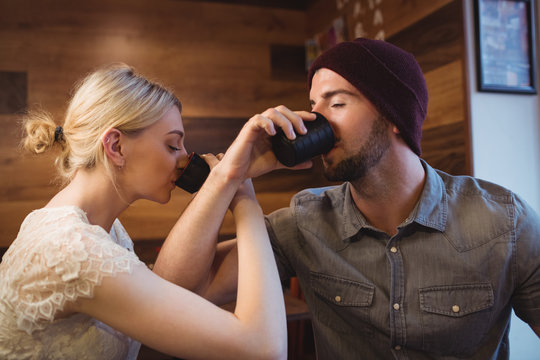 Couple having sake drink in restaurant