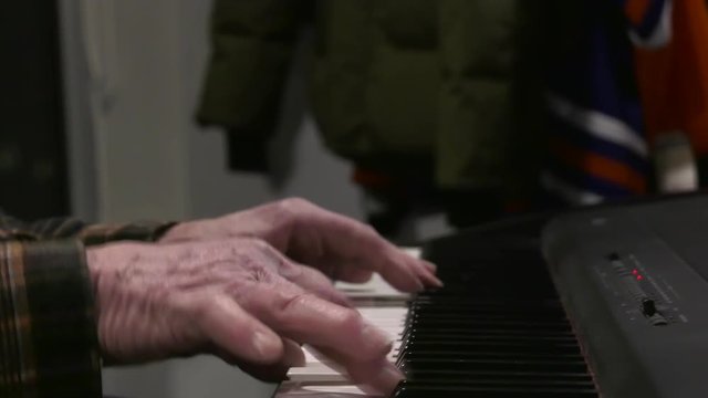 old man hands playing piano slider effect