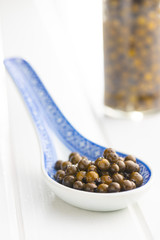 Green peppercorn in brine.
