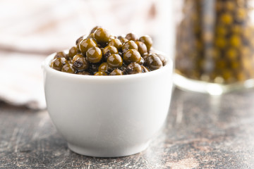 Green peppercorn in brine.