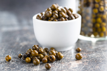 Green peppercorn in brine.