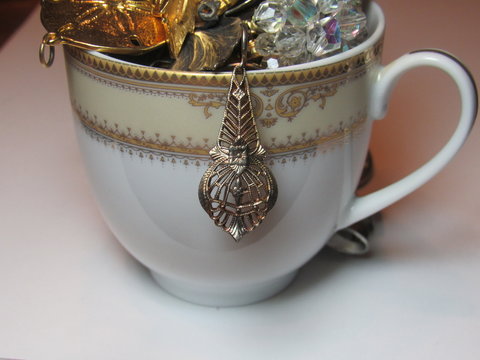 vintage jewelry and a tea cup