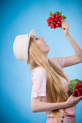 Young woman holding radish