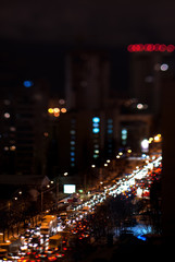 Fototapeta na wymiar winter evening city traffic cars on the road, blurred motion