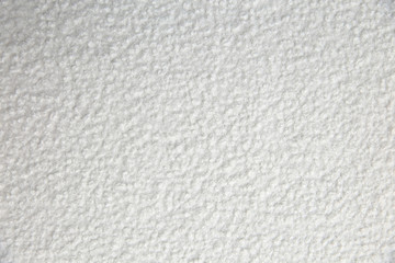 Cotton blanket with an interesting texture and crumpled irregularly in a rather artistic way.

