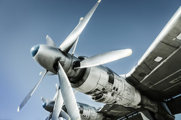 Fragment of old airplane. Engine on wing