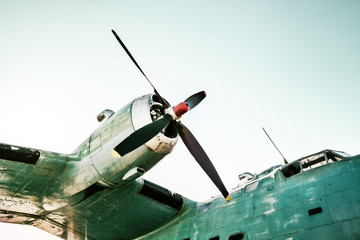 Fragment of old airplane. Engine on wing