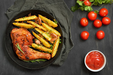 Grilled chicken leg with herbs and fried potatoes