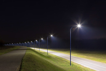 empty street at night with modern LED streetlights
