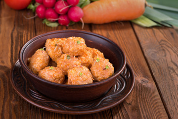 Meatballs with tomato sauce in a ceramic bowl