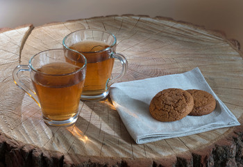 Hot tea outdoors with cookies.