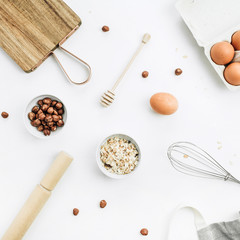 Muesli ingredients on white background. Flat lay, top view. Healthy nutrition concet.