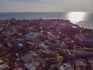 AERIAL view of the Stone Town, old part of Zanzibar City. Flight above main city of Zanzibar, Tanzania, Africa, Indian Ocean