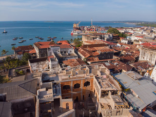 AERIAL view of the Stone Town, old part of Zanzibar City. Flight above main city of Zanzibar, Tanzania, Africa, Indian Ocean