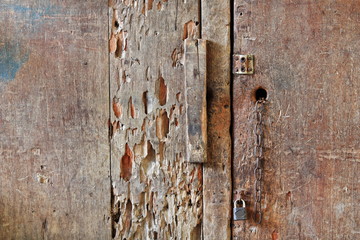 Woodworm infected wooden door closed-retail counter of market stall. Sipalay-Philippines. 0406