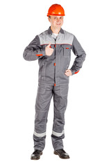 Full length portrait of a male builder over white wall background. repair, construction, building, people and maintenance concept.