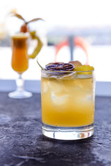 Fresh cocktail juice made of oranges and other summer fruits