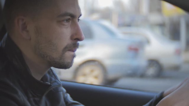 Fatigue driving car. A man rides on the vehicle of exhaustion and falls asleep.