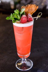 Fresh cocktail juice made of oranges and other summer fruits