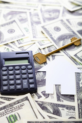 Cardboard house,calculator and key