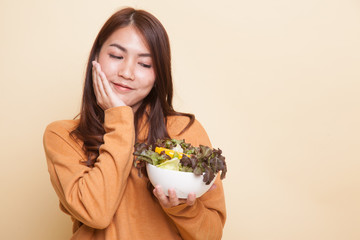 Healthy Asian woman with salad.