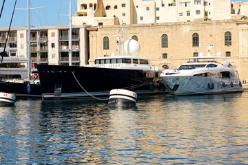 The view on Vittoriosa and modern yachts in sunset, Malta