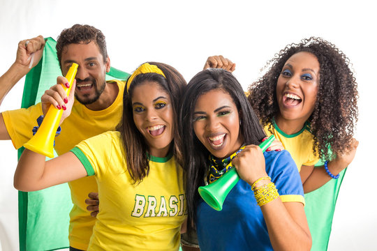Brazilian group of fans celebrating on football match on white background.