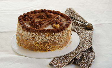 homemade kiev cake, dacquoise cake with butter cream and hazelnuts