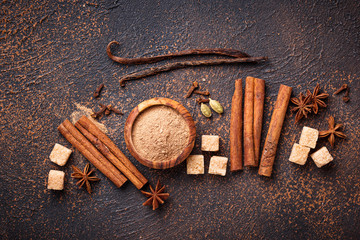 Fototapeta na wymiar Cinnamon, anise, cardamom, clover and sugar