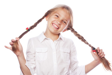 Cute blonde girl with pigtails smiling isolated on white background