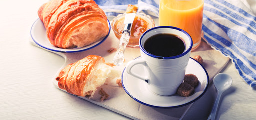 Croissant with Jam Espresso Coffee and a glass of Orange Juice Tradition of the Sunset Morning Baking Sweet Dessert Toned image