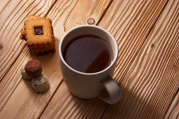 Cup of Tea with Cookies on wooden background