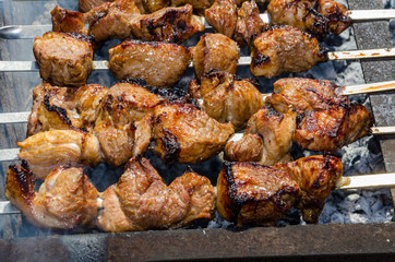 Fresh hot shish kebab on lamb and pork charcoal