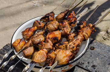 Fresh hot shish kebab on lamb and pork charcoal