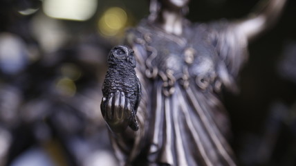 Statue of a woman with an owl