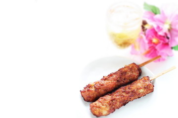 Japanese food, grilled mince chicken Tsukune and Plum wine 