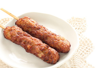 Japanese food, grilled mince chicken Tsukune on whtie background with copy space 