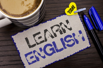 Conceptual hand writing showing Learn English. Business photo showcasing Study another Language Learn Something Foreign Communication written on Sticky Note wooden background Today Coffee Marker.
