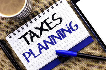 Text sign showing Taxes Planning. Conceptual photo Financial Planification Taxation Business Payments Prepared written on Notebook Book on the jute background Tablet Coffee Cup and Pens next to it