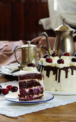 Black forest cake, Schwarzwalder Kirschtorte, Schwarzwald pie, dark chocolate and cherry dessert on wooden background