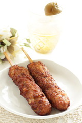 Japanese food, mince chicken grilled Yakitori Tsukune and wine