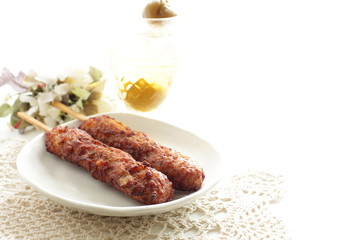 Japanese food, mince chicken grilled Yakitori Tsukune and wine
