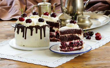 Black forest cake, Schwarzwalder Kirschtorte, Schwarzwald pie, dark chocolate and cherry dessert on wooden background