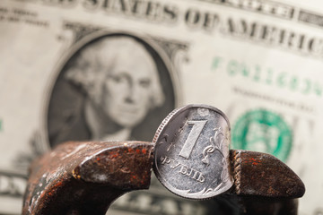 Russian ruble is in a vice with space for text. Economy of Russia is falling and the currency of...