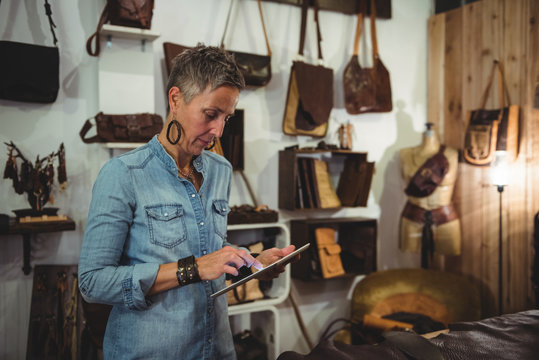 Craftswoman using digital tablet