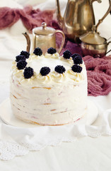 many layers cake with Vanilla Cream and blackberry, Cake Milchmädchen, milky girl , silver coffee pots